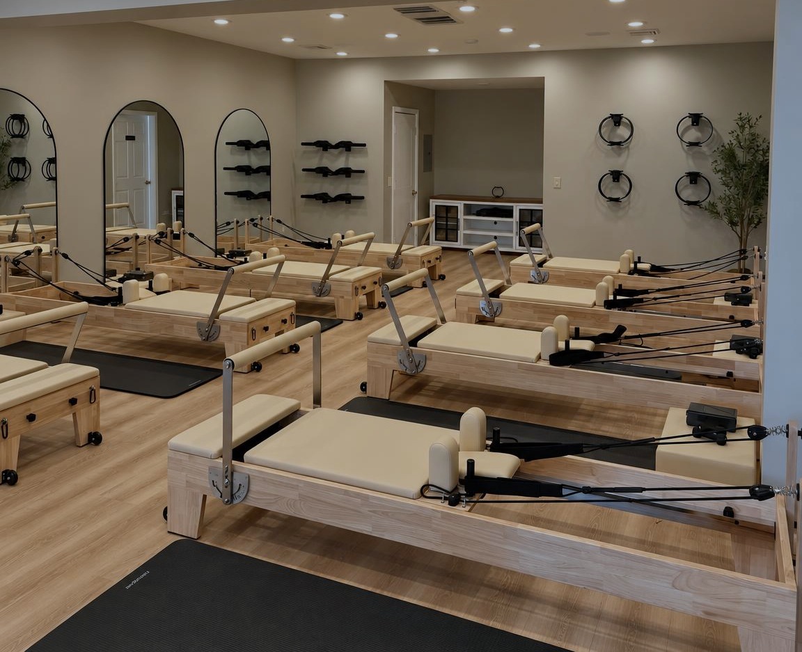 The Pilates House studio floor, lined with reformers